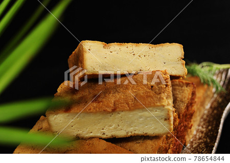 Dried tofu cubes on plate 78654844
