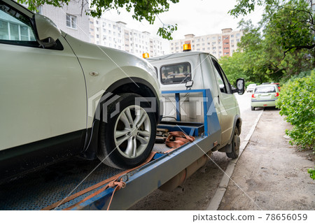 car is transported on tow truck.transporting cars after accidents and breakdowns car is transported on tow truck.transporting cars after accidents and breakdowns 78656059