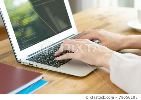 A woman's hand heading to a computer 78656195