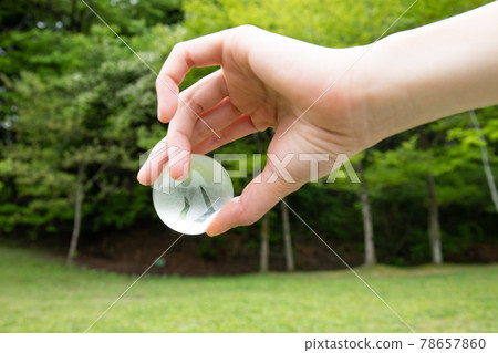 Transparent earth held in hand Transparent earth held in hand 78657860
