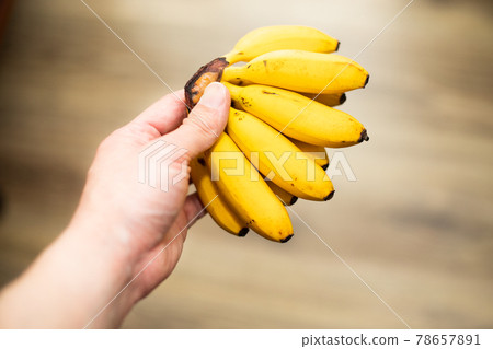 Banana in hand Banana in hand 78657891