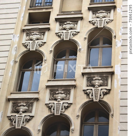 Architectural building with three diagonal rows of windows on different levels 78661295