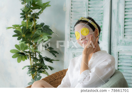 Young woman doing a face pack Young woman doing a face pack 78661701