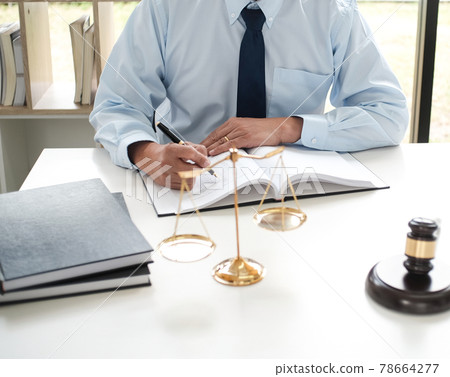 Lawyer Legal counsel presents to the client a signed contract with gavel and legal law. justice and lawyer Business partnership meeting concept. 78664277