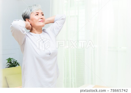 Elderly professional woman working from home during covid-19 pandemic Elderly professional woman working from home during covid-19 pandemic 78665742
