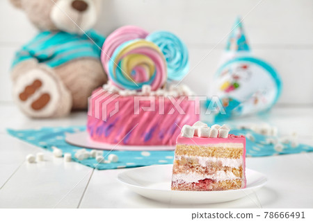 Piece of sponge cake with yoghurt cream, banana and strawberry 78666491