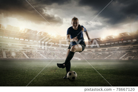 Female soccer, football player dribbling ball in motion at the stadium during sport match on cloudy sky background. Collage Female soccer, football player dribbling ball in motion at the stadium during sport match on cloudy sky background. Collage 78667120