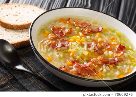 Swiss style Bundner Gerstensuppe hearty Barley Soup close up in the plate. Horizontal 78669276