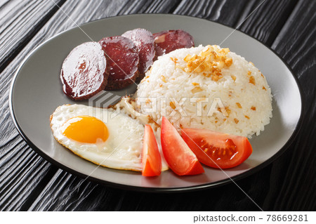 Filipino Fried Rice Recipe Sinangag with crispy garlic, egg and meat close up in the plate. Horizontal Filipino Fried Rice Recipe Sinangag with crispy garlic, egg and meat close up in the plate. Horizontal 78669281
