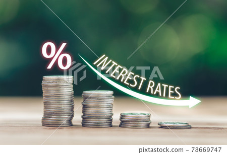 Coins place on the wood table is ladder. with white illustration shows decreasing of interest rates. Coins place on the wood table is ladder. with white illustration shows decreasing of interest rates. 78669747