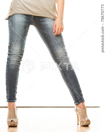 woman legs in denim trousers high heels shoes woman legs in denim trousers high heels shoes 78670773