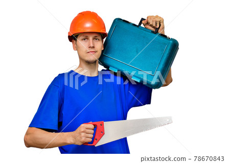 Portrait of a young builder on a light background. A worker in a construction helmet with tools in 78670843