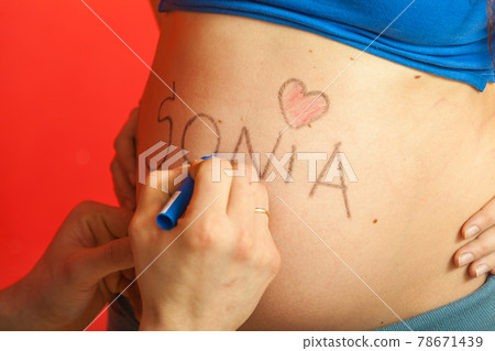 Pregnant woman belly with drawings Pregnant woman belly with drawings 78671439
