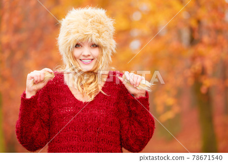 Portrait of pretty smiling woman in fur winter hat Portrait of pretty smiling woman in fur winter hat 78671540