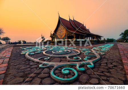 Architecture of Church temple with bodhi tree glowing and fluorescence painting on the floor in the evening at Wat Sirindhorn Wararam or Wat Phu Prao Architecture of Church temple with bodhi tree glowing and fluorescence painting on the floor in the evening at Wat Sirindhorn Wararam or Wat Phu Prao 78671660