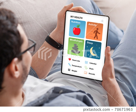 Young man enjoying brand new health app on tablet 78671963