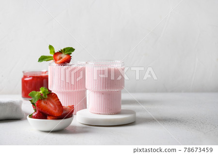 Indian strawberry lassi or milkshake on white background 78673459