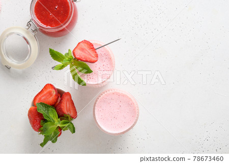 Indian strawberry lassi or milkshake on white background 78673460