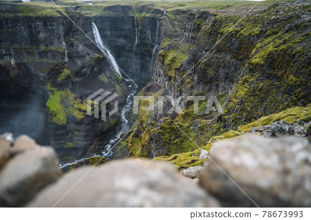 Granni waterfall fallen into deep canyon. Popular tourist travel destination in Iceland. Beauty of nature concept background. 78673993