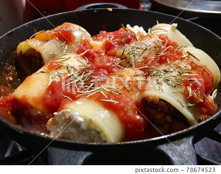 Paccheri stuffing cooking Paccheri stuffing cooking 78674523