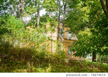 KOUVOLA, FINLAND - SEPTEMBER 20, 2018: Beautiful yellow old building of abandoned Anjala manor. The building was built at the turn of the 19th century and belonged to the Wrede family from 1837. KOUVOLA, FINLAND - SEPTEMBER 20, 2018: Beautiful yellow old building of abandoned Anjala manor. The building was built at the turn of the 19th century and belonged to the Wrede family from 1837. 78674619