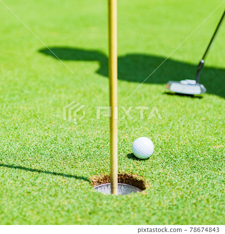 Golf green putting [image of outdoor sports] 78674843