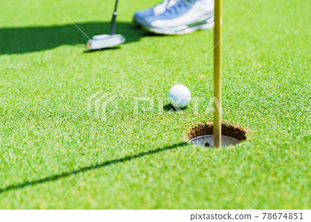 Golf green putting [image of outdoor sports] 78674851