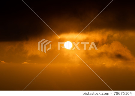 Natural scene of sunset covering by black clouds. 78675104