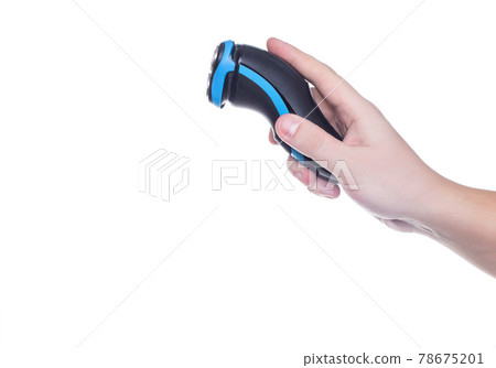 Man holding an electric shaver on a white background, isolate. Close-up, hygiene Man holding an electric shaver on a white background, isolate. Close-up, hygiene 78675201