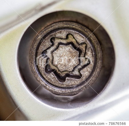 A secret bolt in a car wheel. Anti-theft protection, macro 78676566