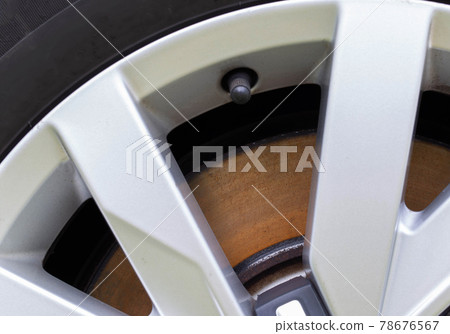 Rusty, defective brake disc with a shoulder on the edge. Worn brake disc concept, brake failure, macro Rusty, defective brake disc with a shoulder on the edge. Worn brake disc concept, brake failure, macro 78676567
