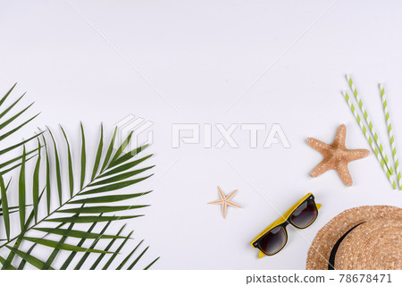Beach accessories: glasses and hat with shells and sea stars on a white background 78678471