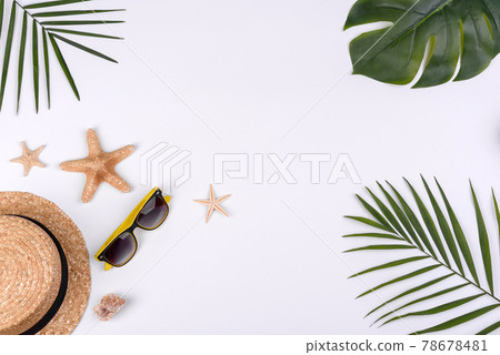 Beach accessories: glasses and hat with shells and sea stars on a white background 78678481