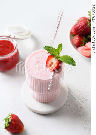 Indian strawberry lassi or milkshake on white background Indian strawberry lassi or milkshake on white background 78679328