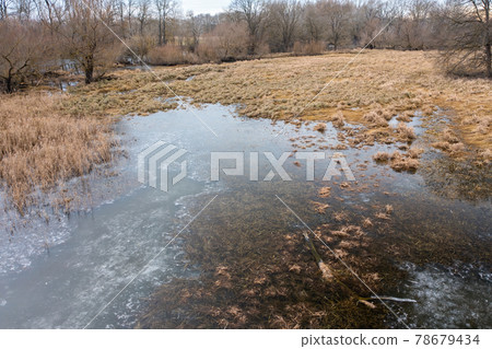Frozen floodplain from drone perspective in winter. Frozen floodplain from drone perspective in winter. 78679434