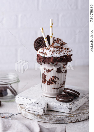 Sweet milkshake with whipped cream 78679686