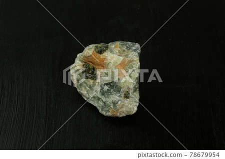 Prehnite green natural mineral stone from Republic of South Africa RSA on black background. Mineralogy, geology, magic of stones, semi-precious stones and samples of minerals. Close-up macro photo. Prehnite green natural mineral stone from Republic of South Africa RSA on black background. Mineralogy, geology, magic of stones, semi-precious stones and samples of minerals. Close-up macro photo. 78679954