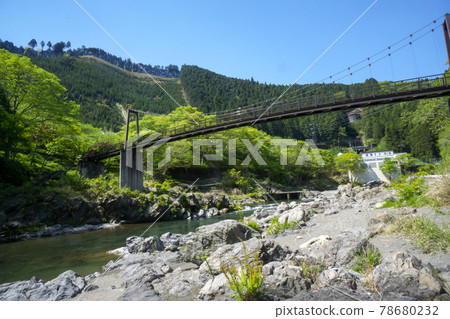 Fresh green Mitake Gorge Suspension bridge over the Tama River Somanoko Bridge seen from the riverbank on the downstream side Fresh green Mitake Gorge Suspension bridge over the Tama River Somanoko Bridge seen from the riverbank on the downstream side 78680232