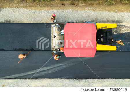Aerial view of new road construction with asphalt laying machinery at work. 78680949
