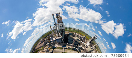 Aerial view of cement factory with high concrete structure and tower crane at industrial production area. Manufacture and global industry concept. Aerial view of cement factory with high concrete structure and tower crane at industrial production area. Manufacture and global industry concept. 78680984