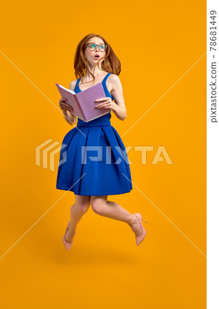 Shy Redead Female Student In Eyeglasses Looking Lost And Shocked, Confused By Education Shy Redead Female Student In Eyeglasses Looking Lost And Shocked, Confused By Education 78681449