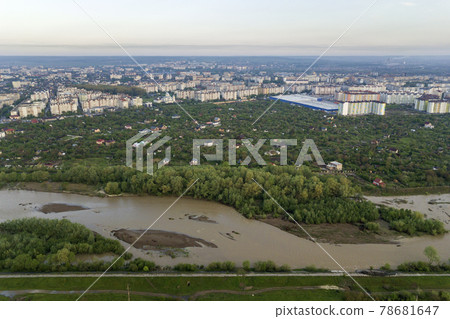 Aerial view of Ivano-Frankivsk city with residential area and suburb houses with a river in middle. Aerial view of Ivano-Frankivsk city with residential area and suburb houses with a river in middle. 78681647