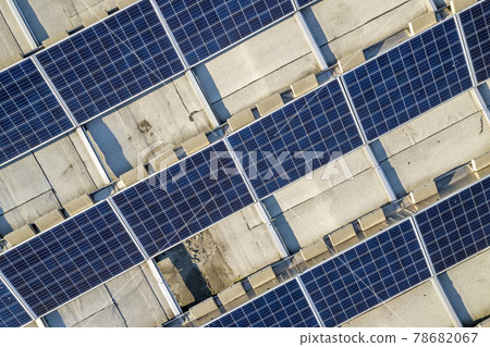 Top view of blue shiny solar photo voltaic panels system producing renewable clean energy abstract background. Top view of blue shiny solar photo voltaic panels system producing renewable clean energy abstract background. 78682067
