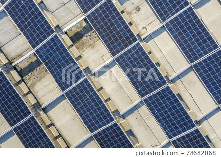 Top view of blue shiny solar photo voltaic panels system producing renewable clean energy abstract background. 78682068