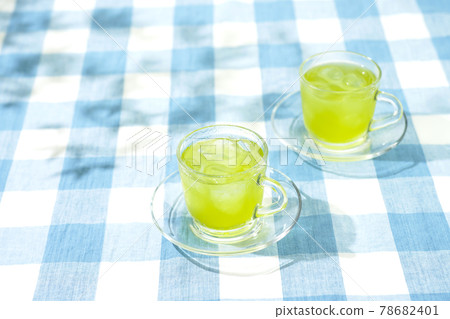 2 customers' cold tea and light blue tablecloth 2 customers' cold tea and light blue tablecloth 78682401