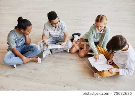 Children Sitting on Floor in Art Gallery 78682680