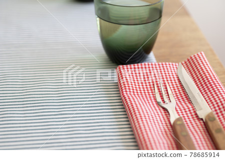 Dining table with forks and knives 78685914