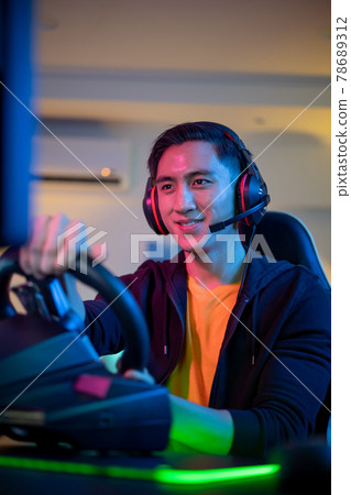 cybersport gamer play car racing 78689312