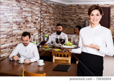 Female waiter showing country restaurant 78690804