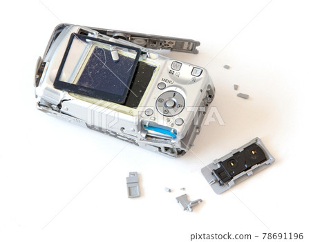Broken old digital camera isolated, obsolete and not in use anymore Broken old digital camera isolated, obsolete and not in use anymore 78691196